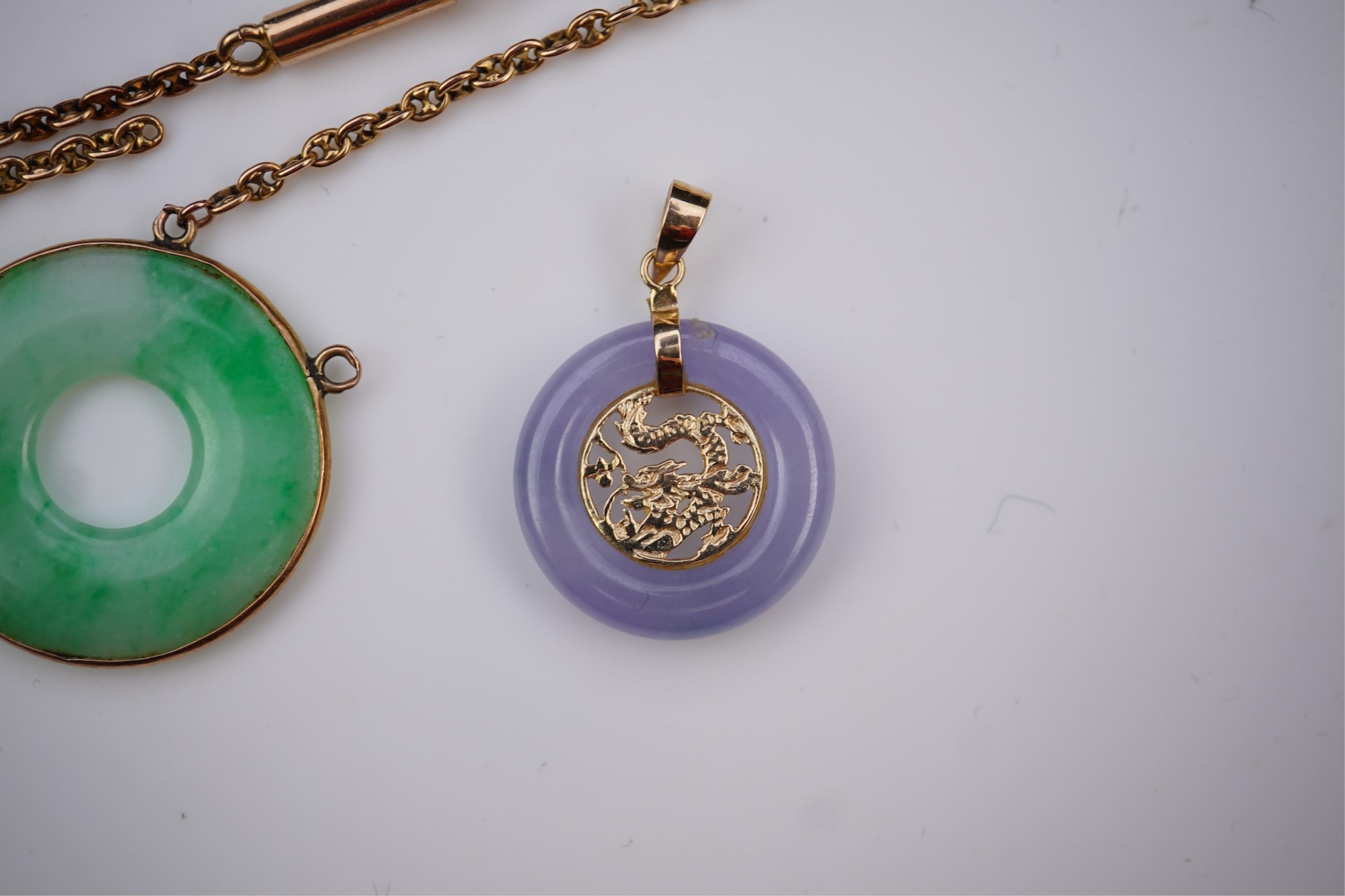 Two jadeite pendants